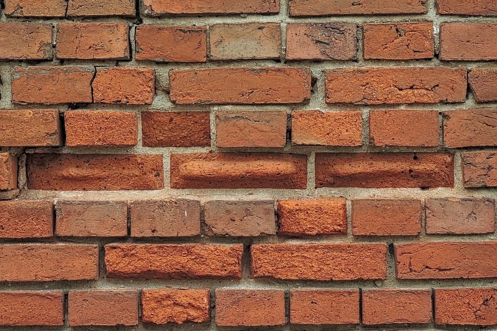 brick wall with cracks